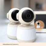 Twee beige-witte Luna Glow babyfoon camera’s naast elkaar, uitbreidbaar tot 2 camera’s